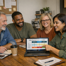 A small business leadership team in a meeting room, confidently review cyber security vendoring